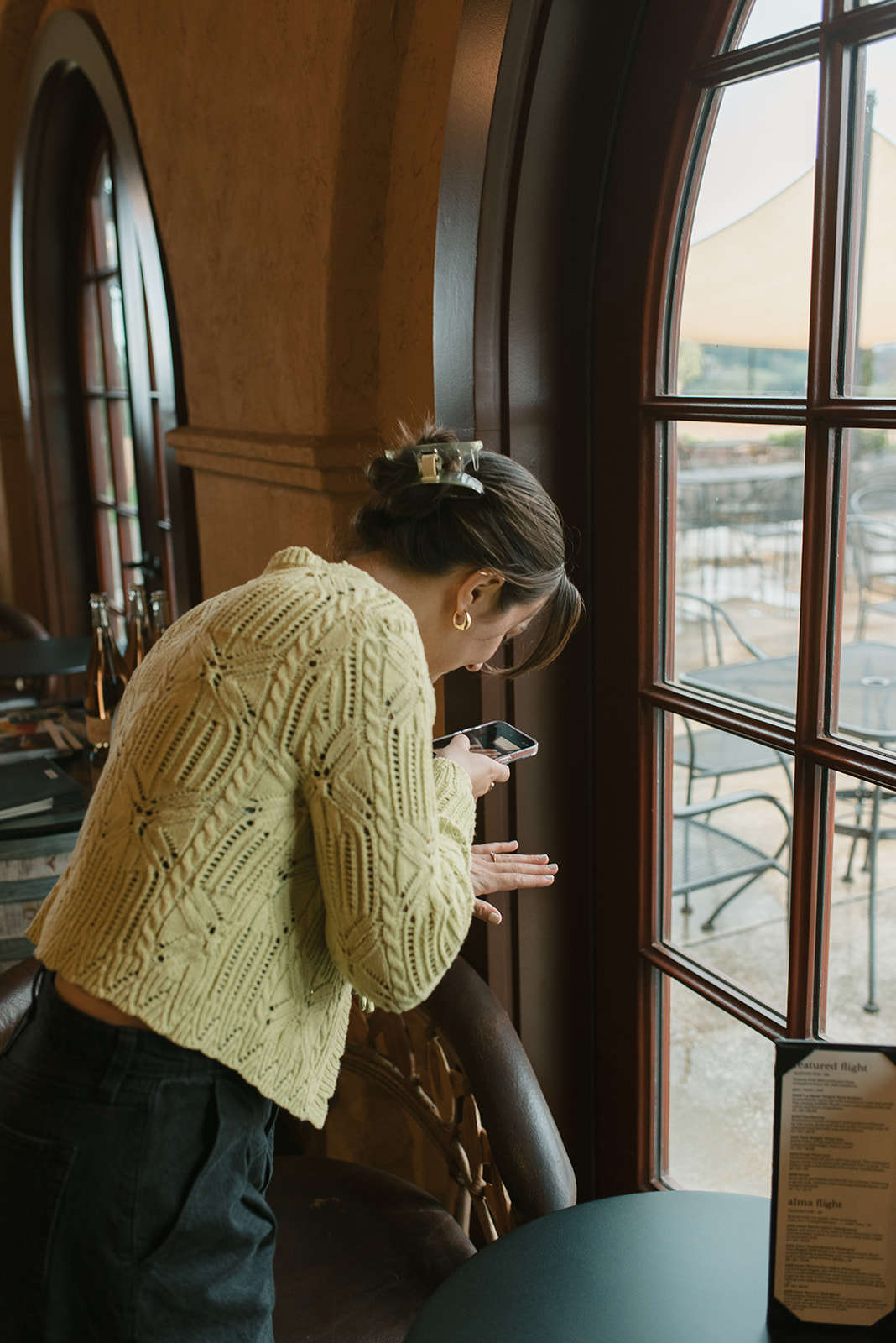 bride taking an admirable photo of her new engagement ring