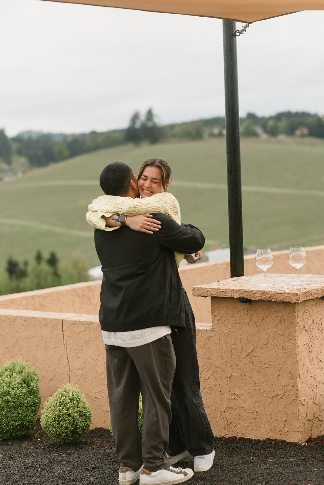 man and woman embrace after just proposing