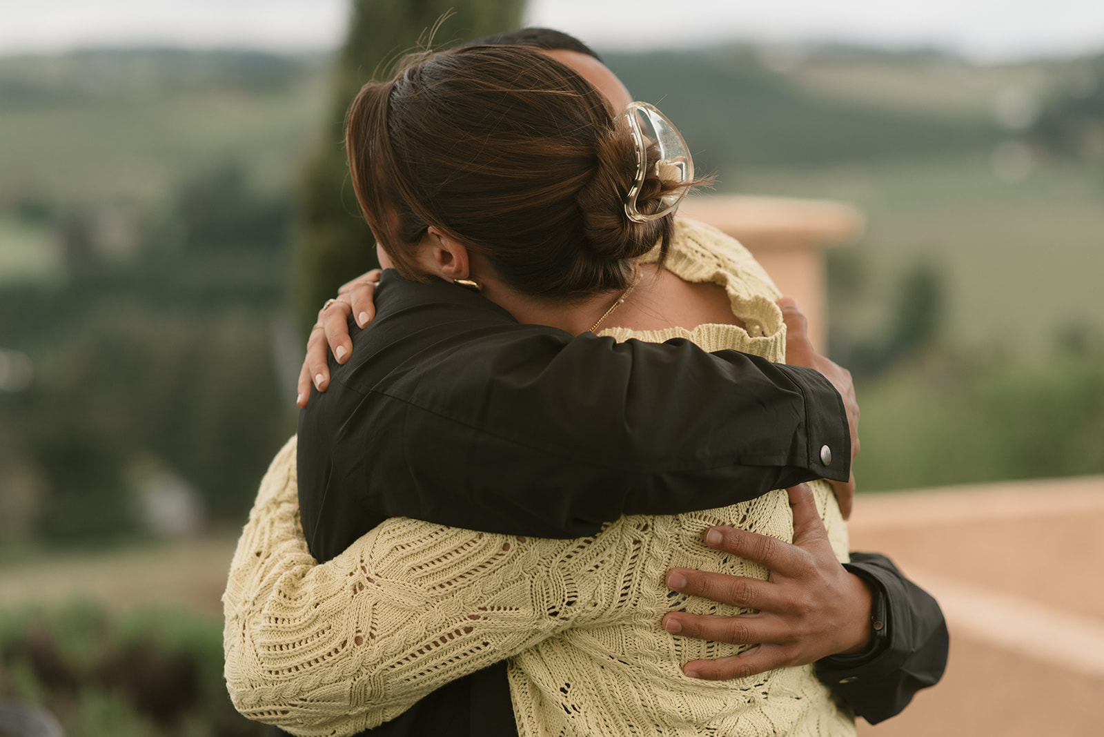 couple embracing after a winery proposal