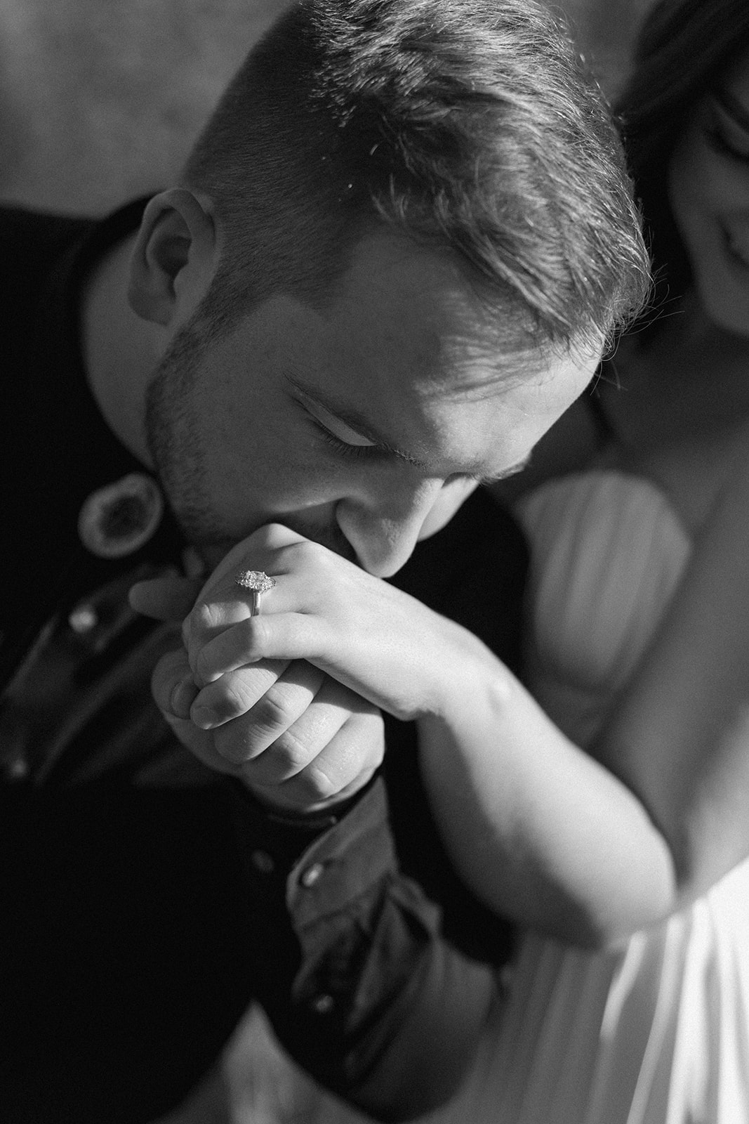 groom kissing the hand of his bride