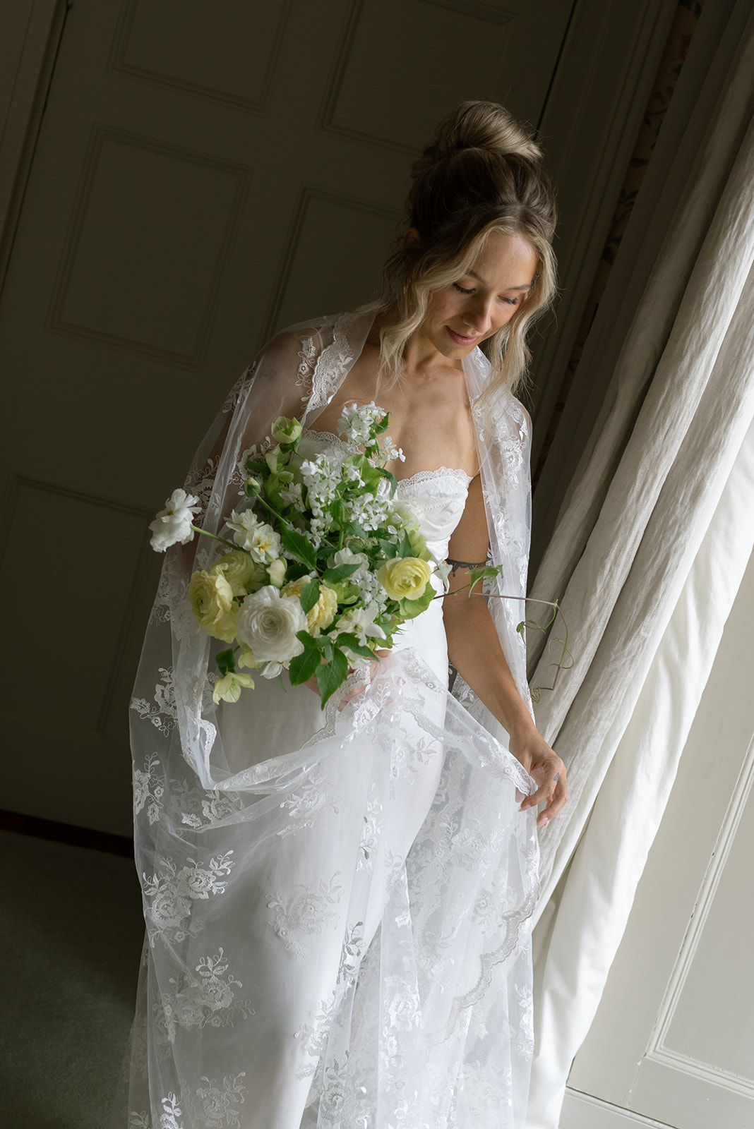 Bride getting ready in a sunlit suite at Hilton Park Manor, Ireland intimate wedding morning moments