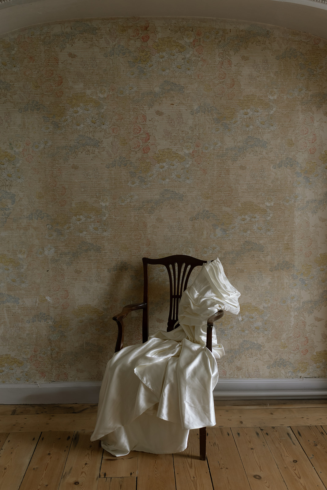 wedding dress laying on a chair at Hilton Park Manor in Ireland