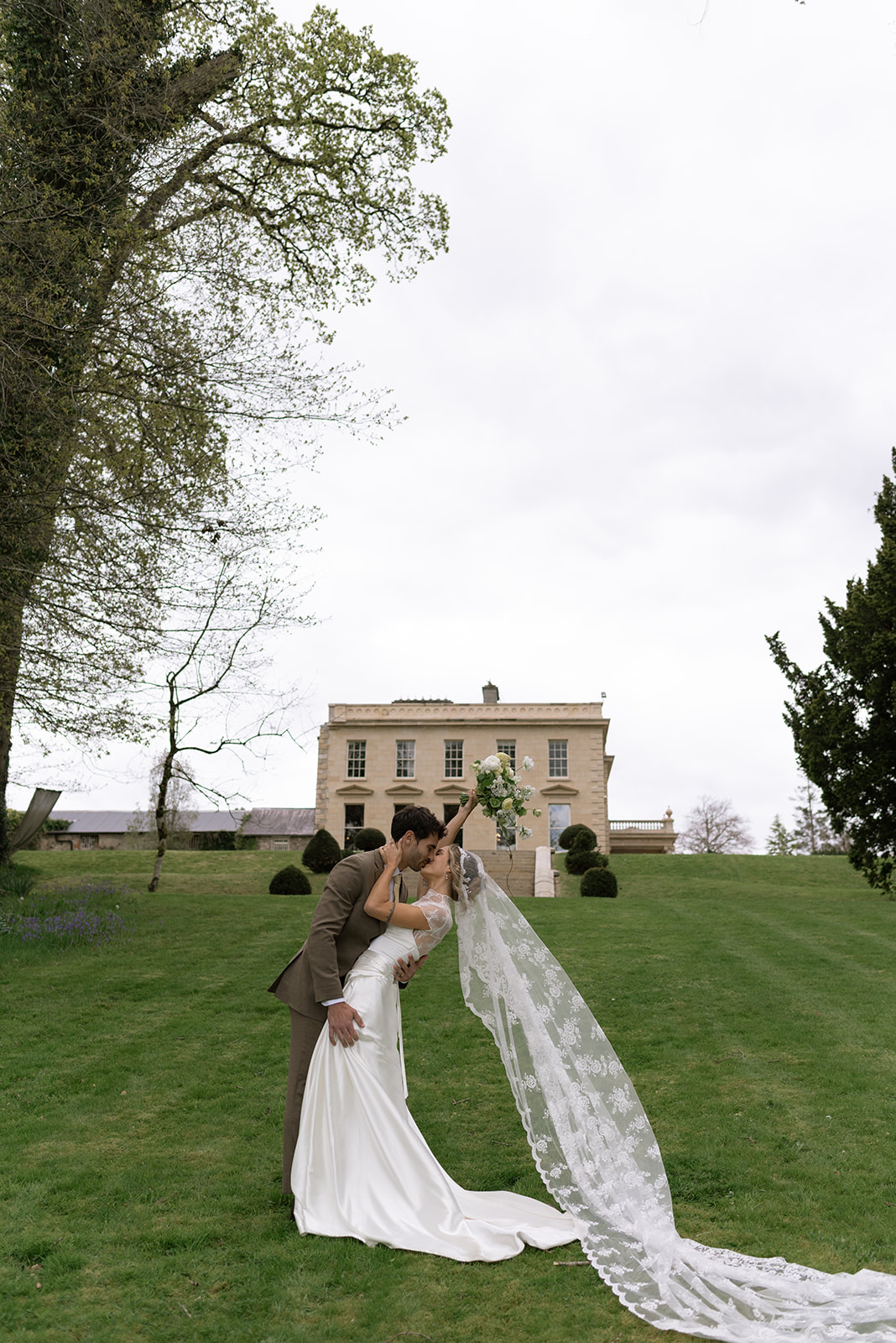bride and groom kissing and celebrating after their intimate ceremony in Ireland
