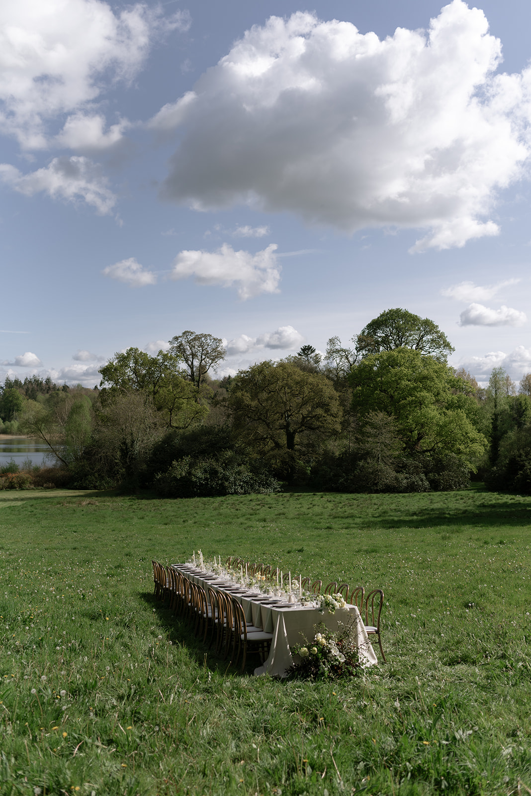 Candlelit dinner table with greenery and linen accents at Hilton Park Manor, intimate wedding reception setup