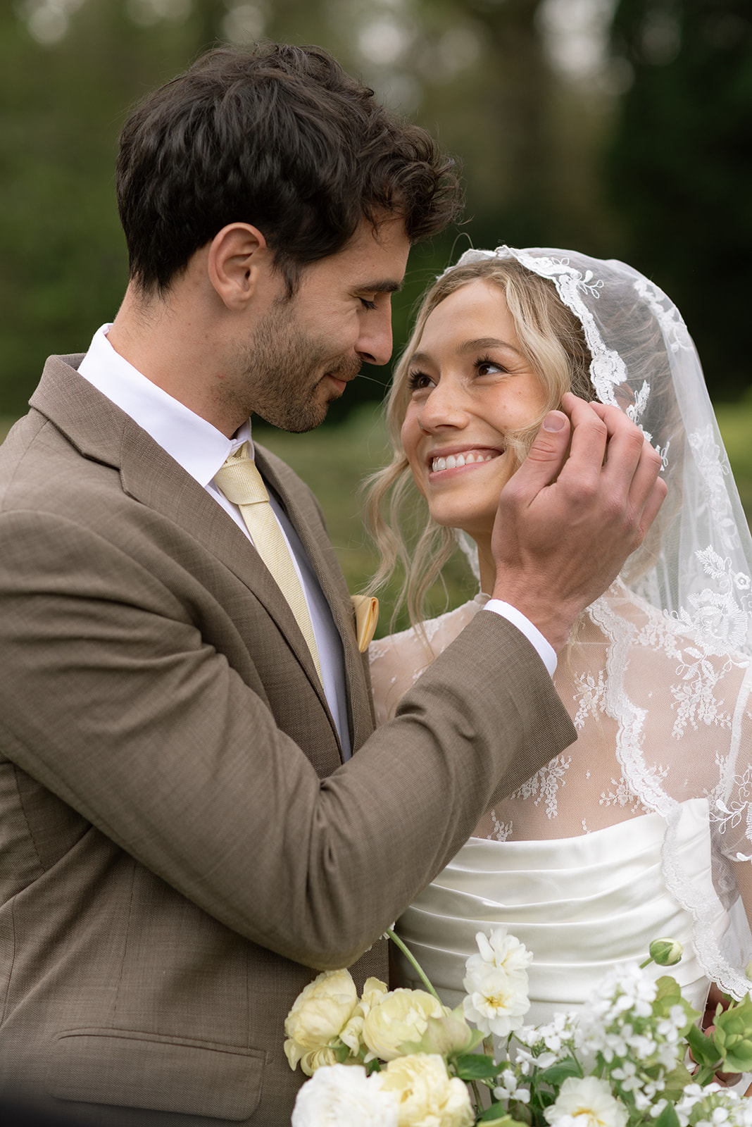 close up of groom brushing bride's cheek after intimate ceremony in ireland
