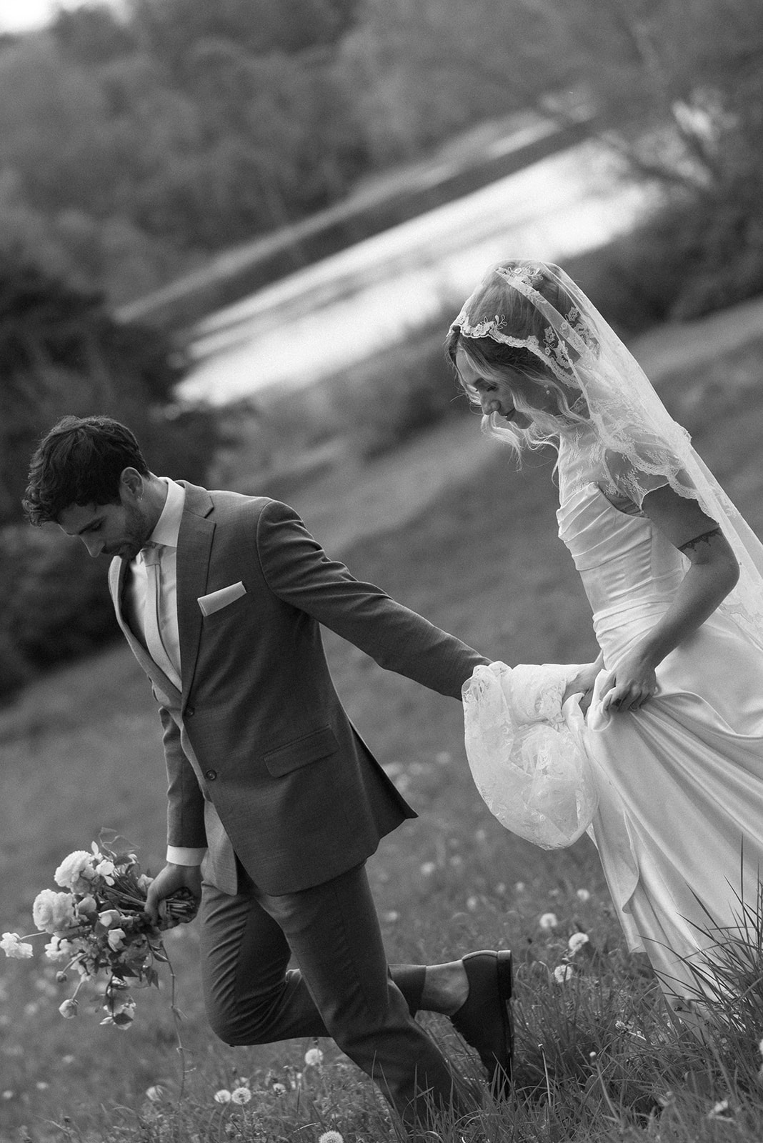 black and white candid photo of couple on their wedding day in ireland