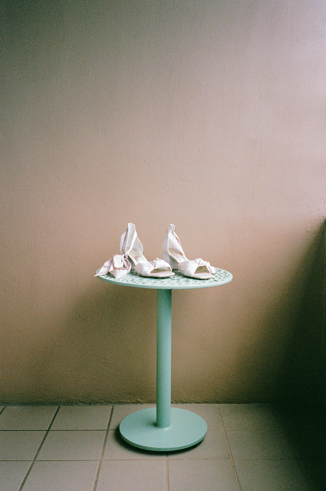 film photo of the brides shoes at her getting ready hotel taken by a destination oahu wedding photographer