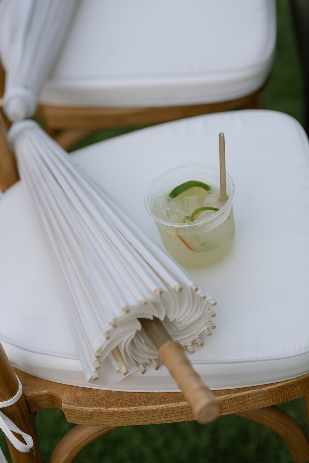 guest umbrella with a signature cocktail at hawaiian wedding
