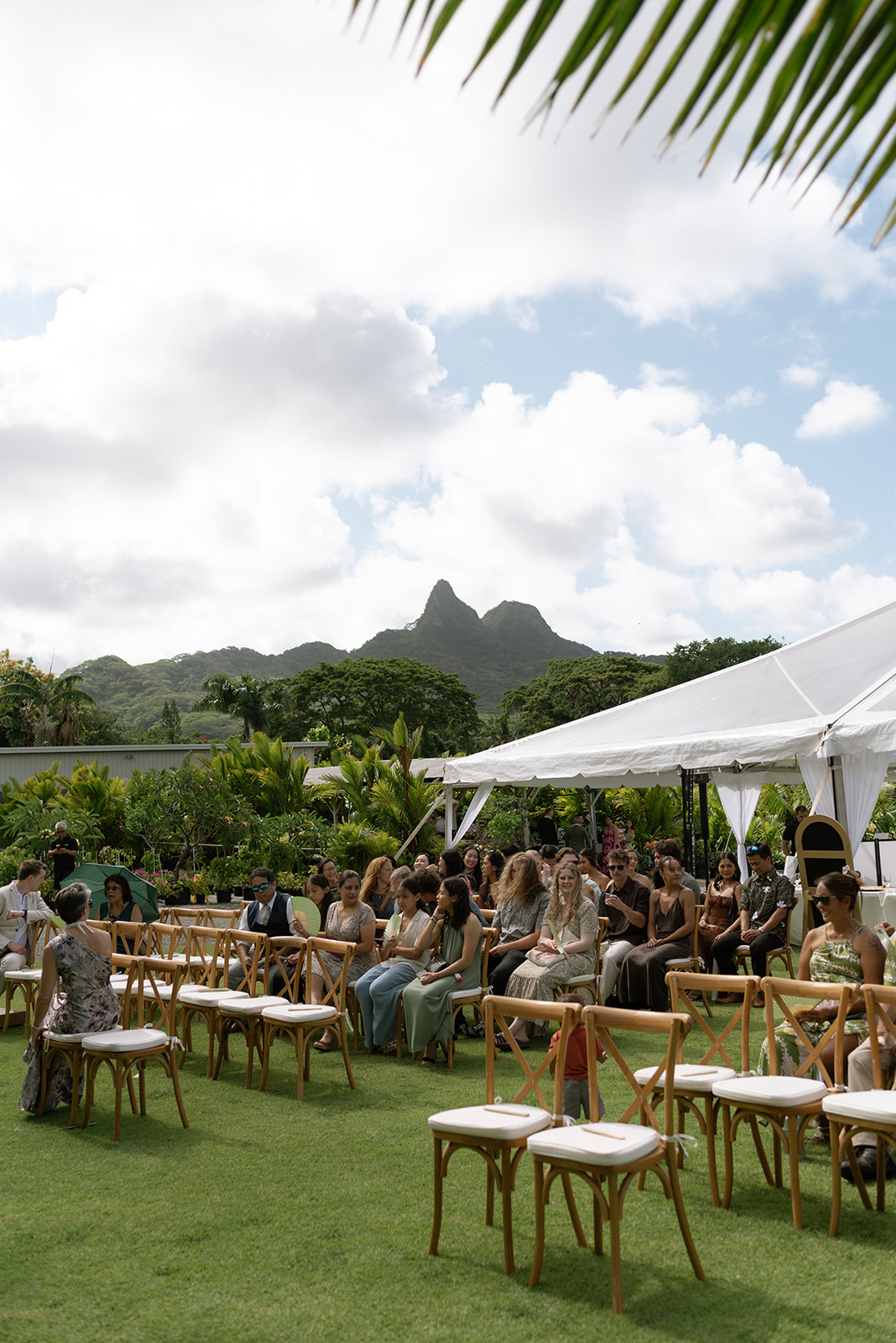 guests seated and waiting for the ceremony to begin taken by a destination oahu wedding photographer